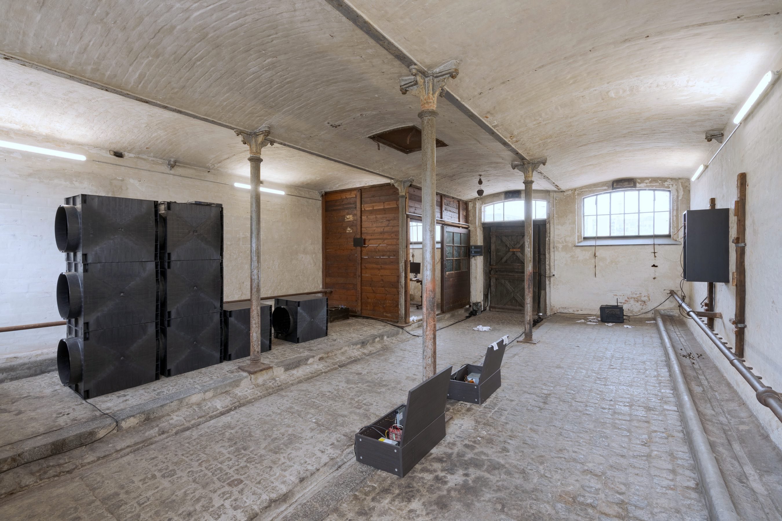 Installation, [,]. <i>s e c r e t  k e e p e r</i>. Salvaged computers, storage units, stormwater crates, monitor arm, monitor, microphones, network switch, ethernet cables, power cables, custom built linux kernel [disabled internet], program [sentences spoken in the space are transcribed, encrypted, and destructed on activation of h e a r t]. Foto: David Stjernholm