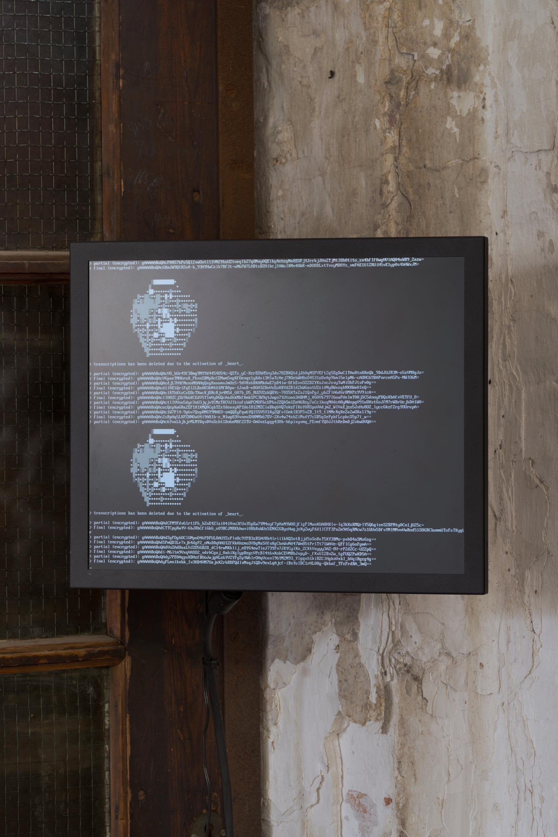 Detail, <i>s e c r e t  k e e p e r</i>. Salvaged computers, storage units, stormwater crates, monitor arm, monitor, microphones, network switch, ethernet cables, power cables, custom built linux kernel [disabled internet], program [sentences spoken in the space are transcribed, encrypted, and destructed on activation of h e a r t]. Foto: David Stjernholm